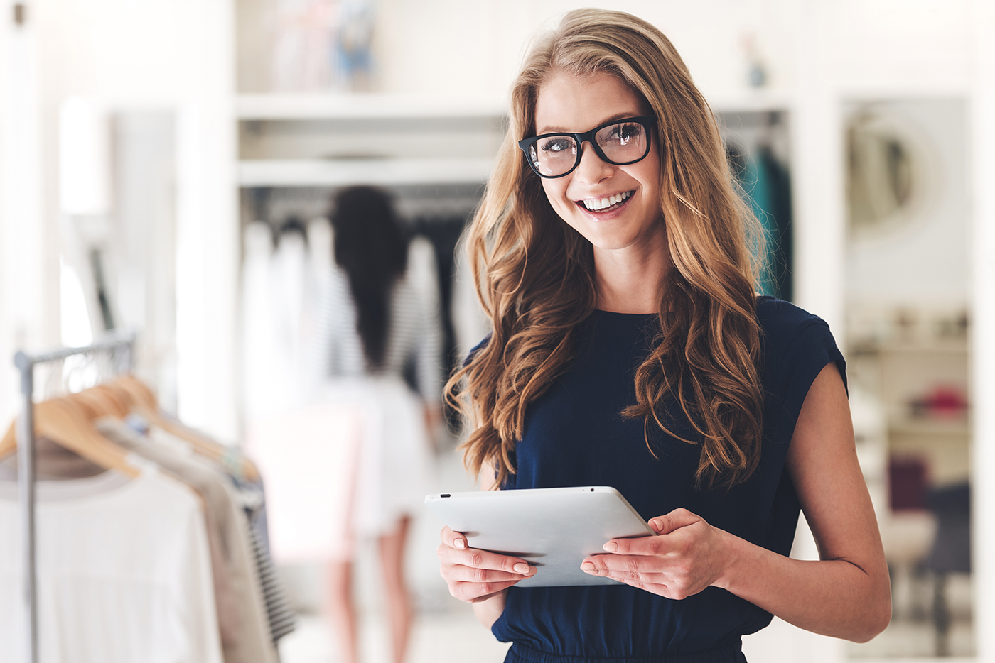 WordPress Site Refresh vs Rebuild: The Intelligent Choice for 2026 8 Happy business owner reviewing updated WordPress website on iPad